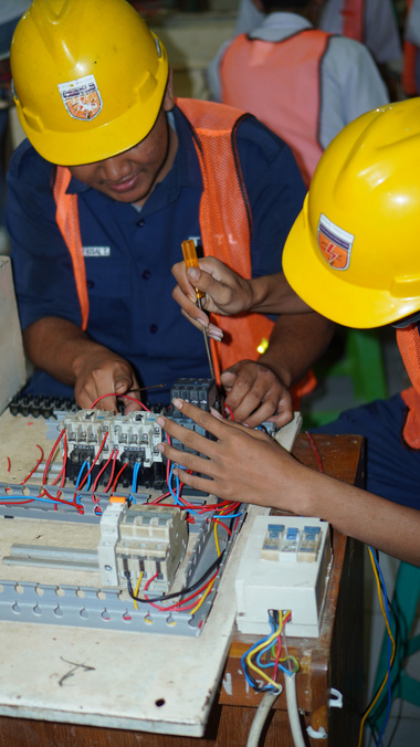 two students majoring in electrical competency are practicing